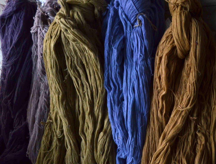 Hanks of specially dyed wool ready for tufting into Mariska's rug